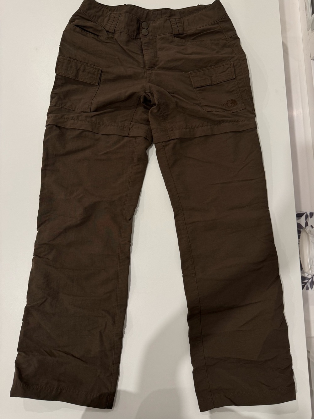 The North Face women’s Brown Cargo Convertible Pants(hidden zipper). Size M.